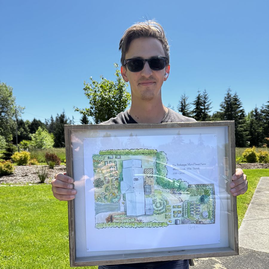 Mr. B holding a framed watercolor he painted