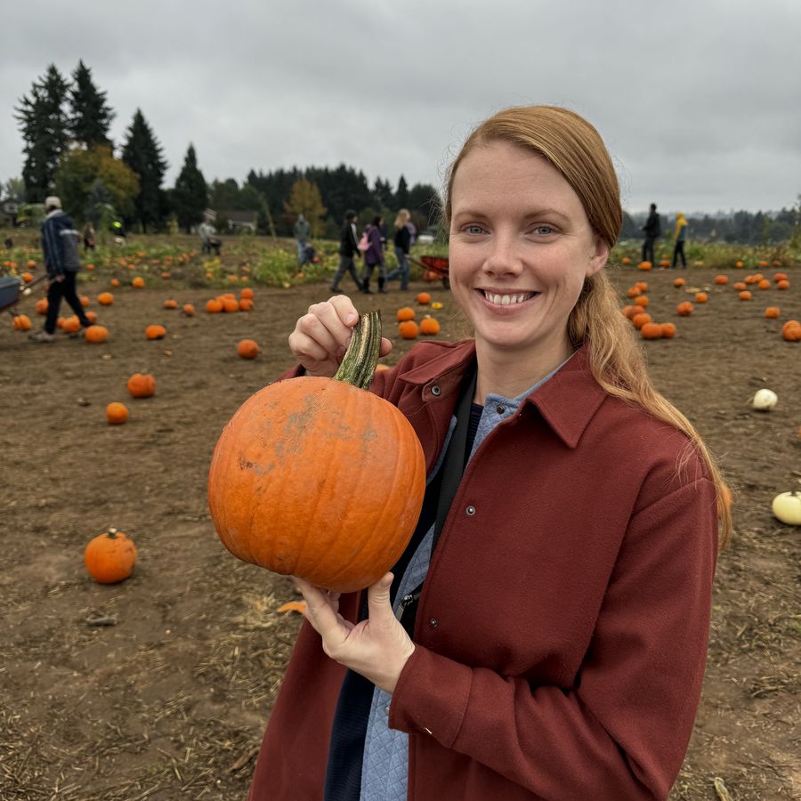 Hillary — Mrs. A — smiling at a pumpkin patch